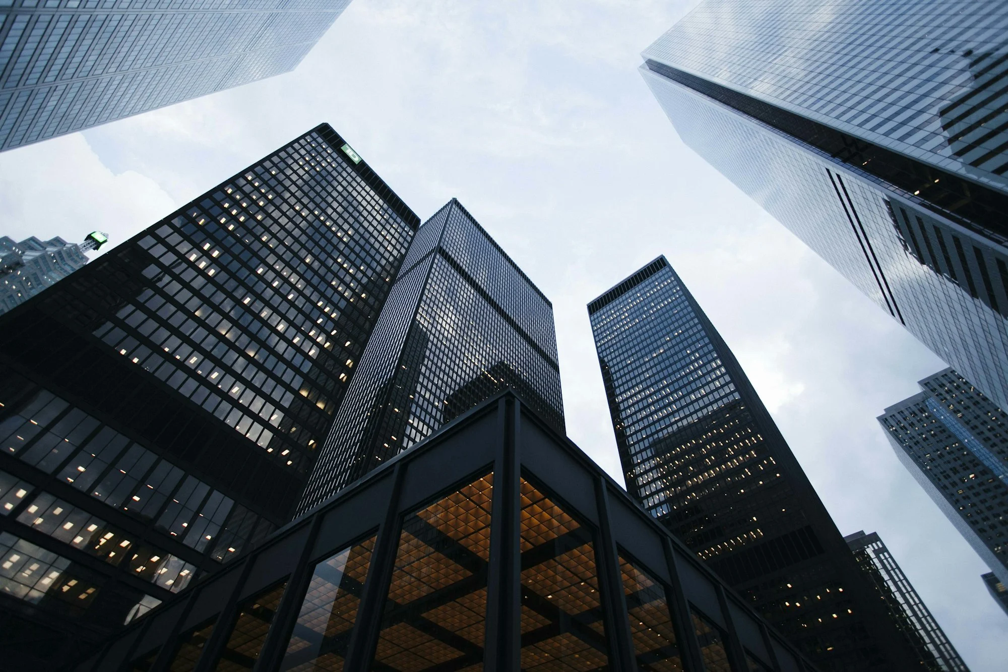 Modern glass conference building at dusk